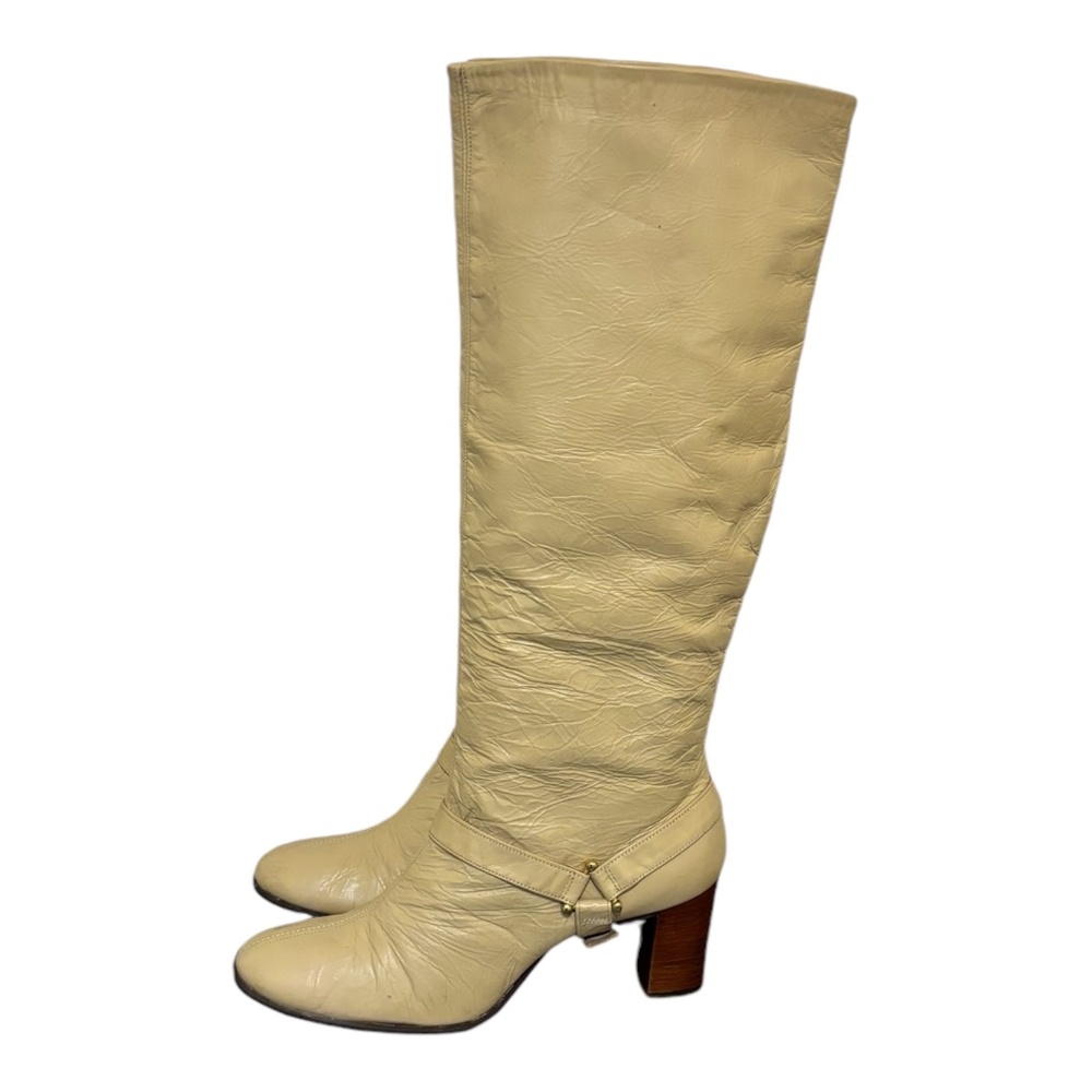 Size 8.5 Vintage tall beige genuine leather women zip up knee high riding boots.